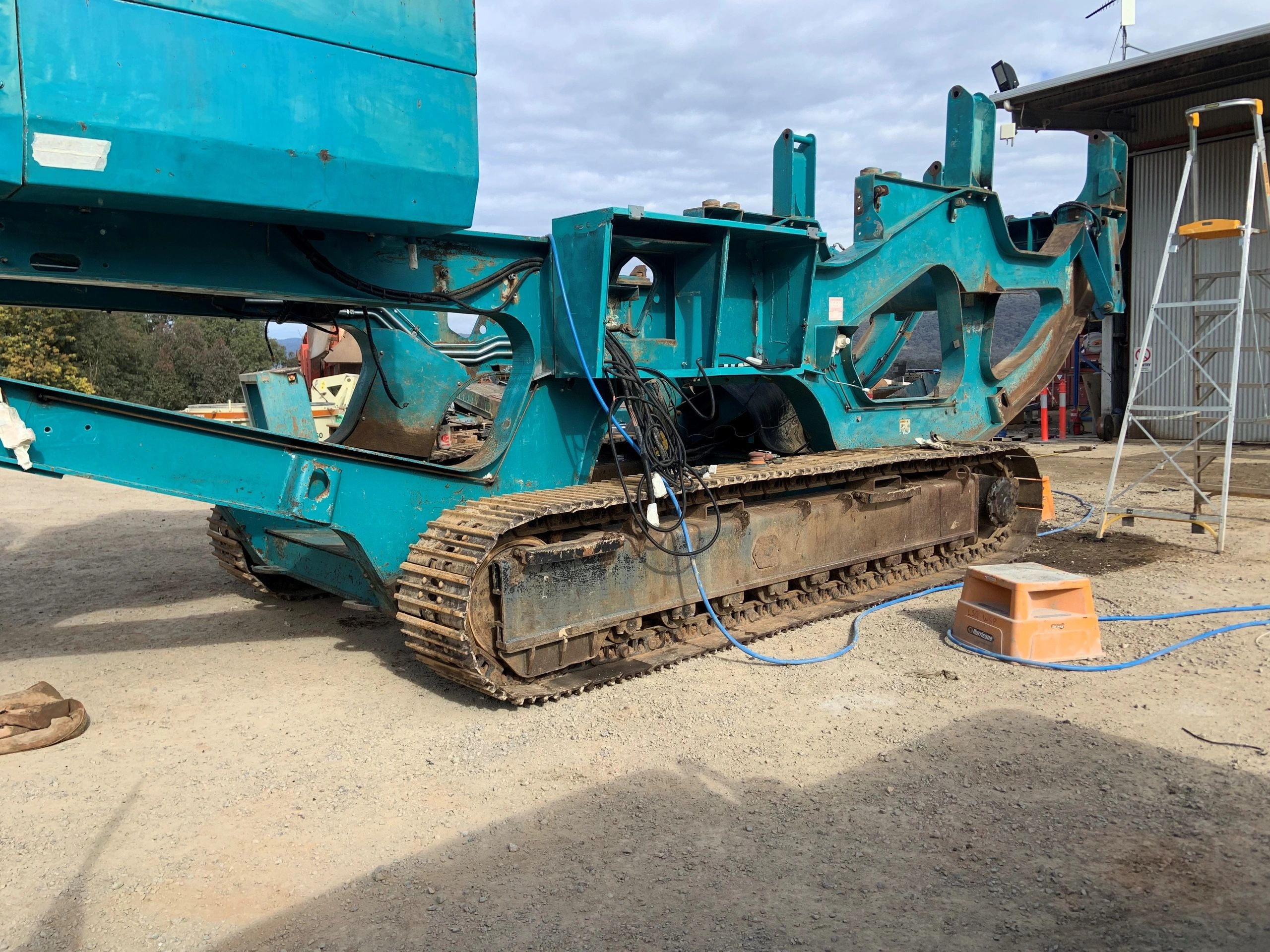 Tracked crusher undercarriage on construction site